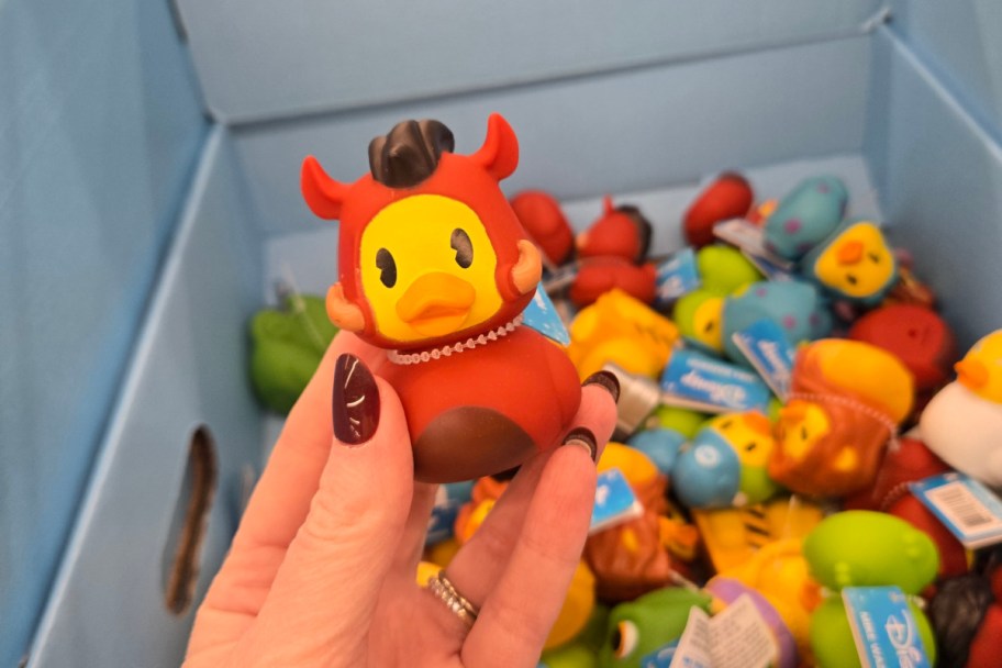 hand holding duck looks like warthog