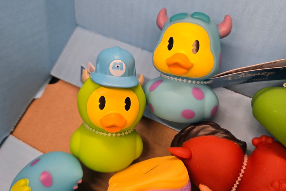 green rubber duck with hat and blue spotted rubber duck