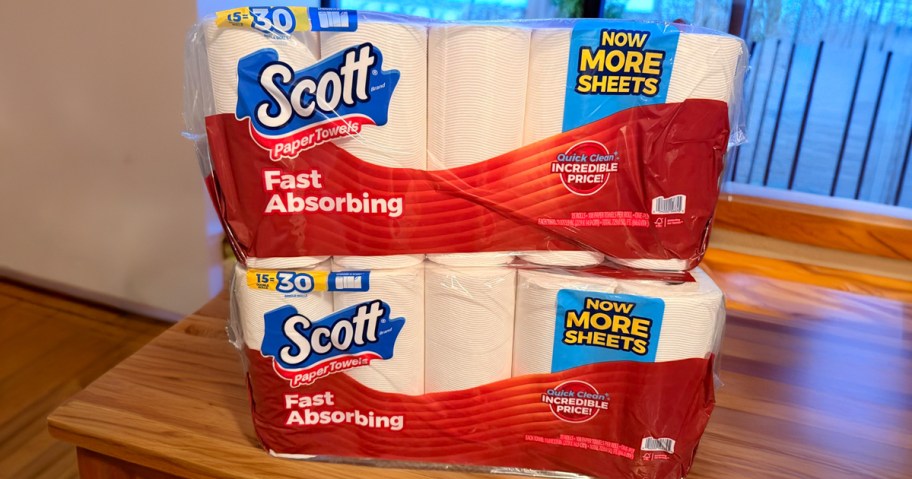 two packs of Scott Paper Towels on a kitchen table