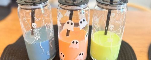 halloween glass sippers filled with drinks on table