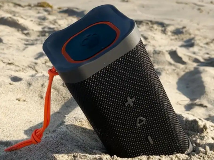 wireless speaker in sand