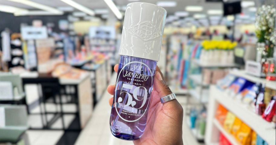 Sol de Janeiro 8.1oz bottle in hand in store