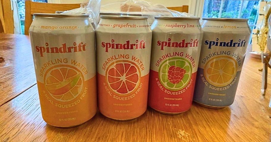 four cand of spindrift sparkling water on table