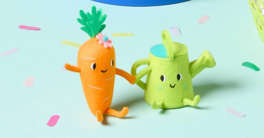 a felt carrot and watering can decor
