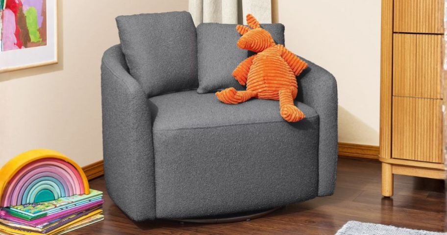 grey kids swivel chair with stuffed animal on it in kids room