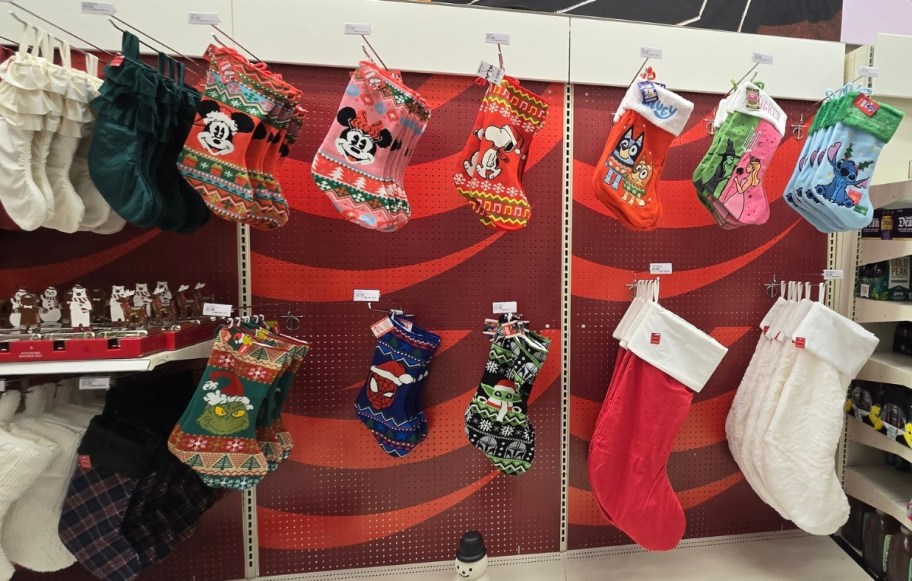assorted chirstmas stockings on a store display wall