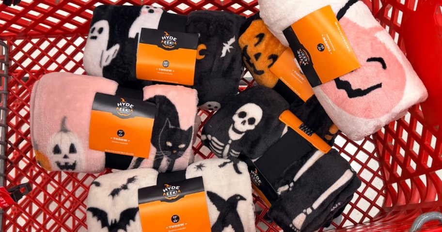 Target shopping cart with Halloween throw blankets in it