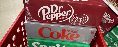 3 soda 12-packs in a target shopping cart
