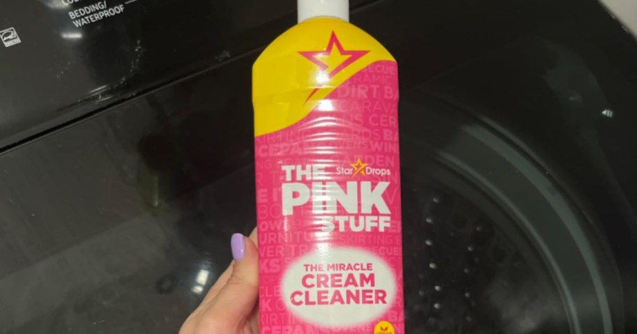 the pink stuff cleaner in hand