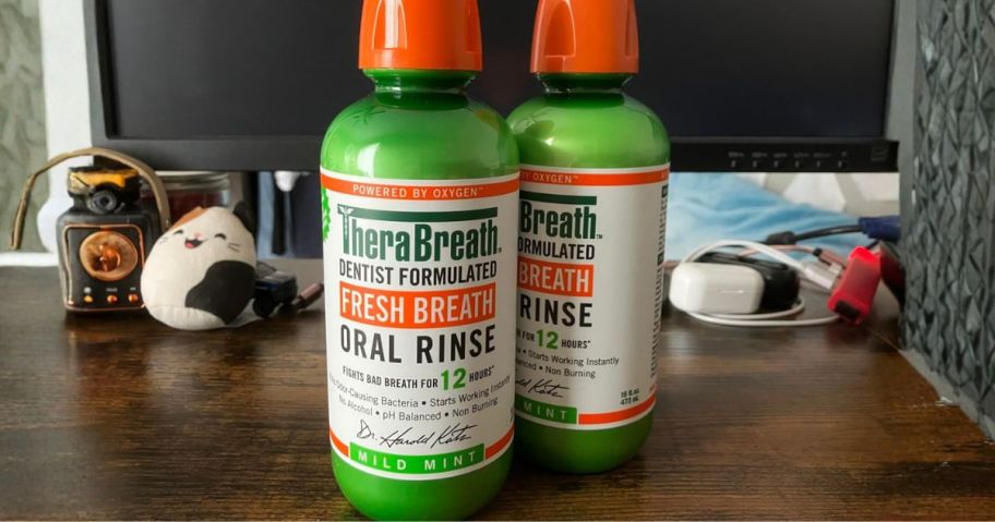 two TheraBreath Fresh Breath Mouthwash 16oz bottles on desk