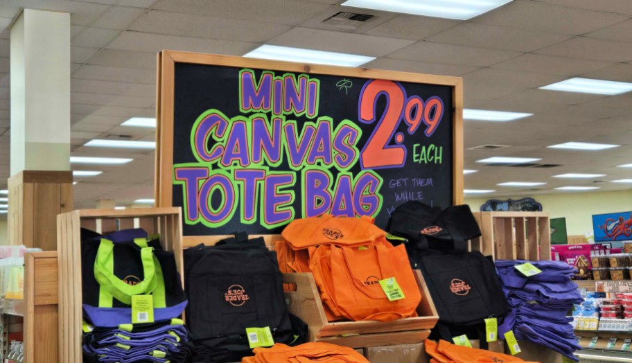 a trader joes in-store display of halloween tote bags
