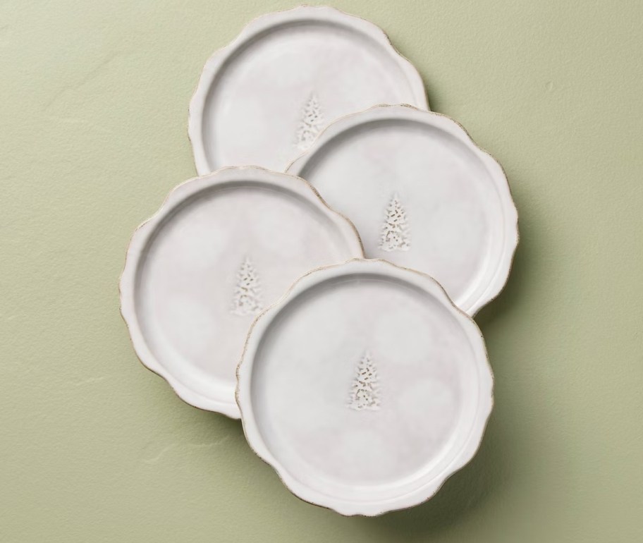 white tree plates on green background