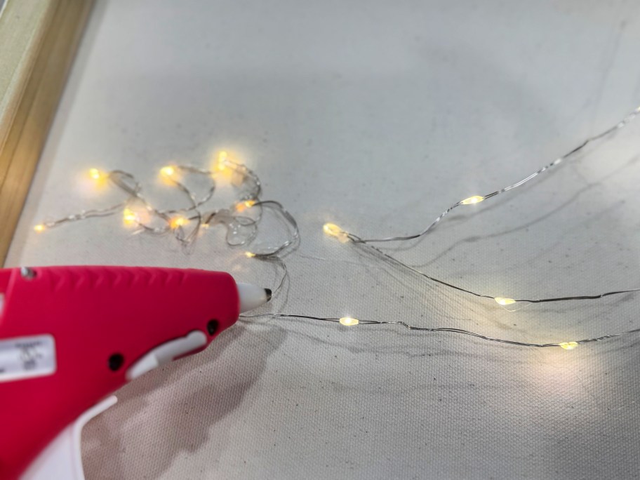 using hot glue on the back of a photo canvas