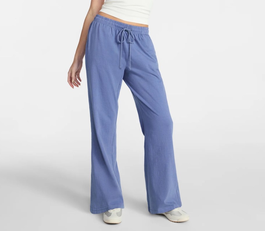 person wearing blue cotton lounge pants 