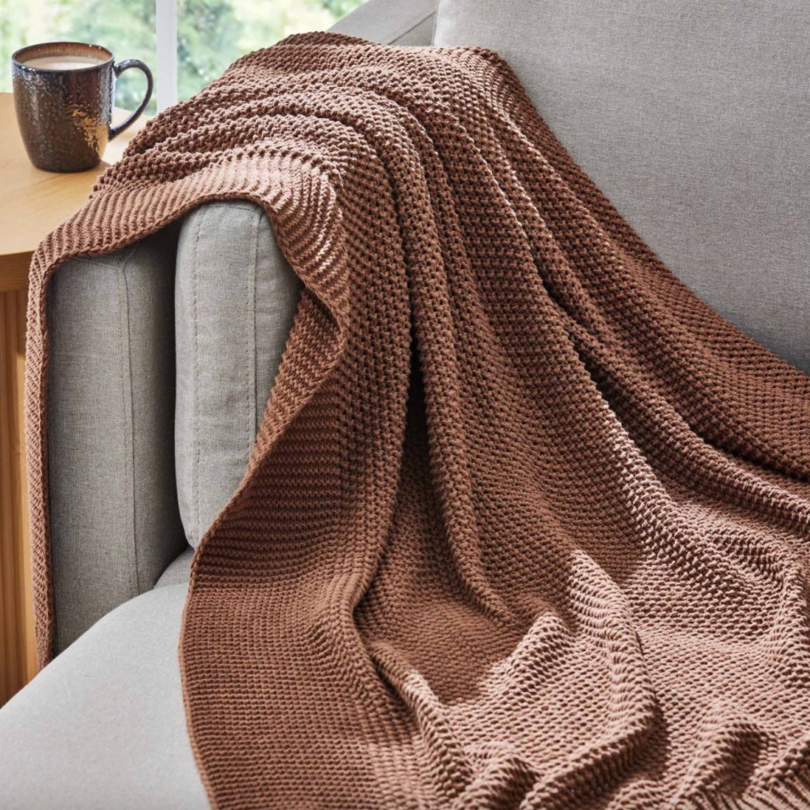 brown knit throw blanket on couch