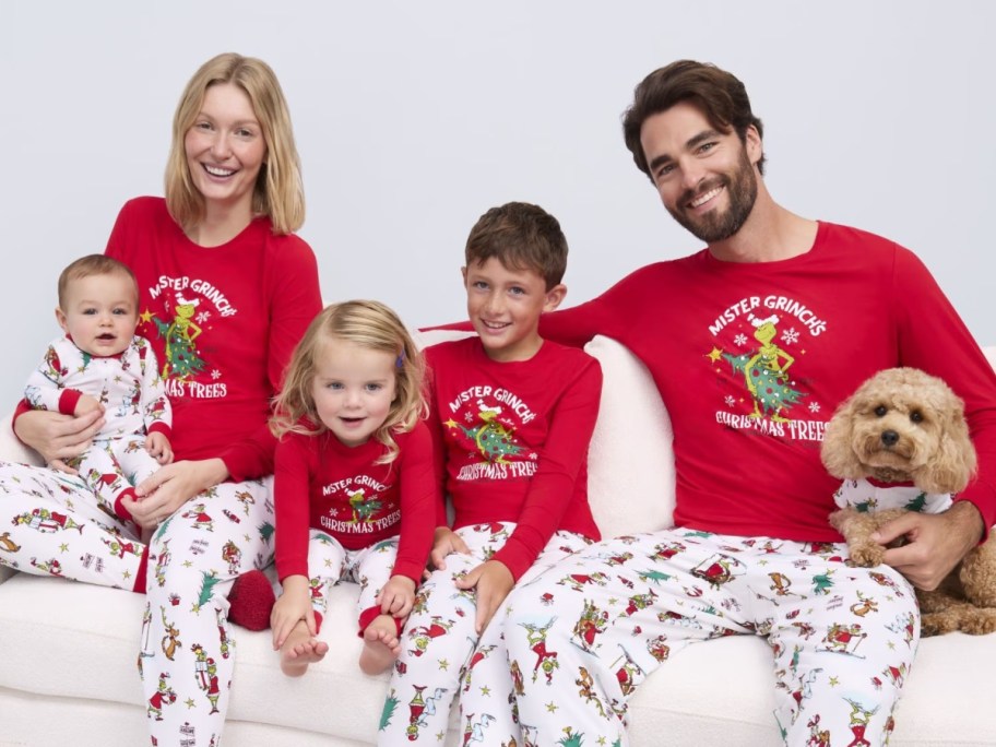 family wearing matching Grinch pajamas