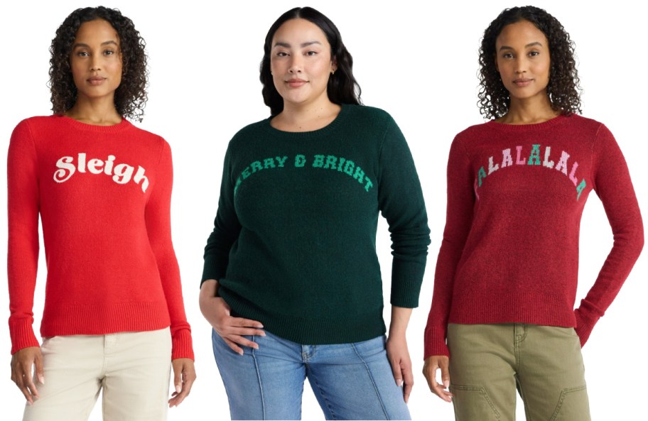 Three woman wearing colorful holiday sweaters.