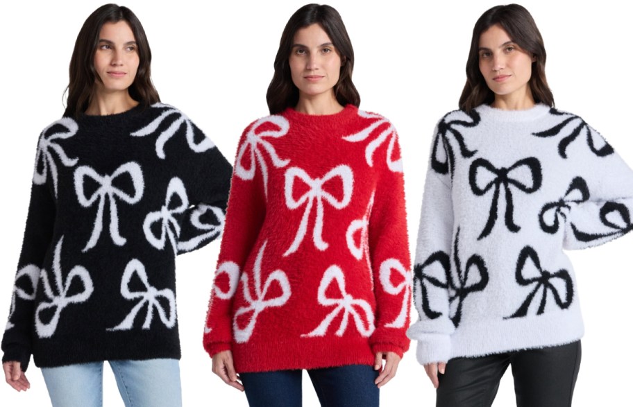 Three woman wearing colorful sweaters with bows.