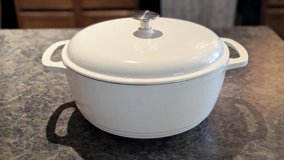 a white enamel dutch oven with lid