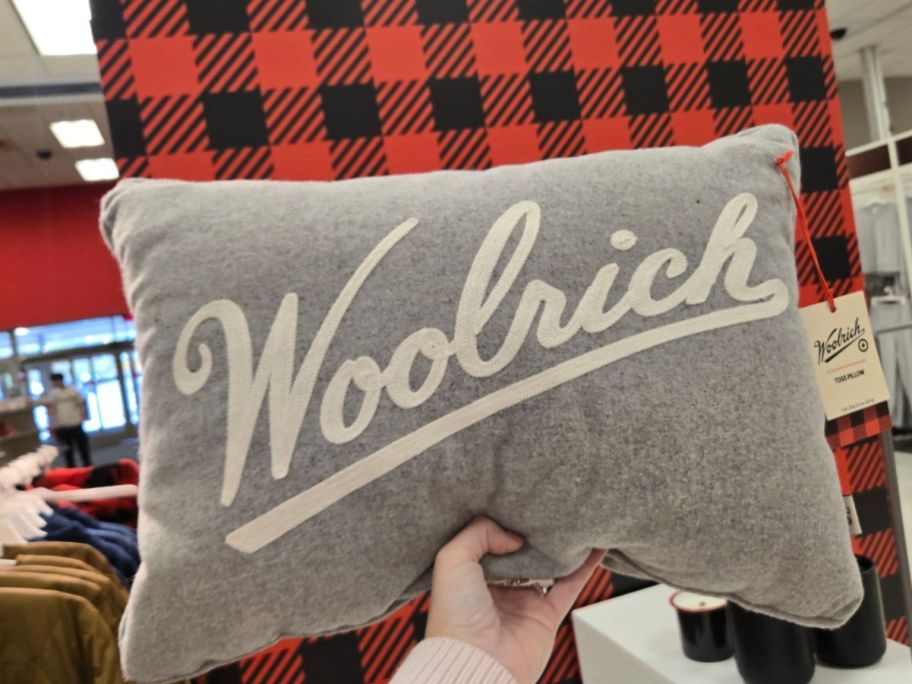Woolrich Embroidered Lumbar Toss Pillow in hand in store
