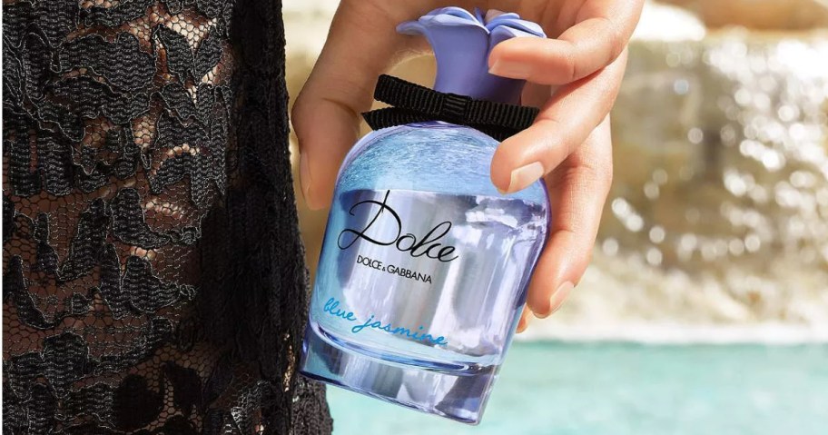 hand holding a bottle of Dolce & Gabbana Blue Jasmine perfume