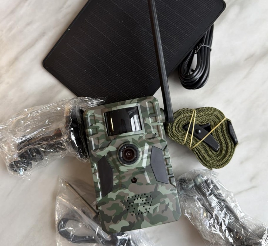 a trail camera shown with solar panel