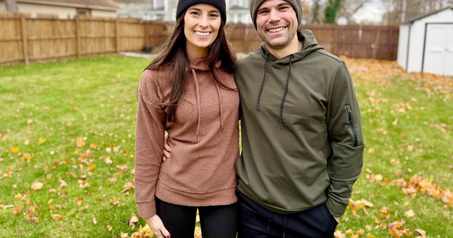 woman wearing red and guy wearing green hoodies