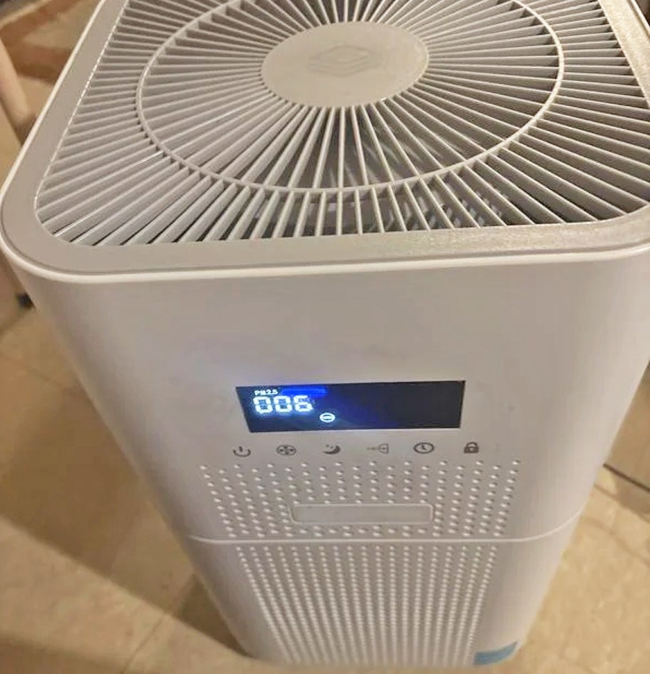 close-up of white air purifier with digital display