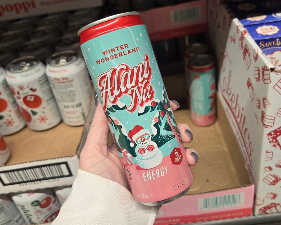 hand holding Alani Nu Winter Wonderland Energy Drink