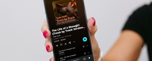 hand holding a phone playing taylor swift on amazon music