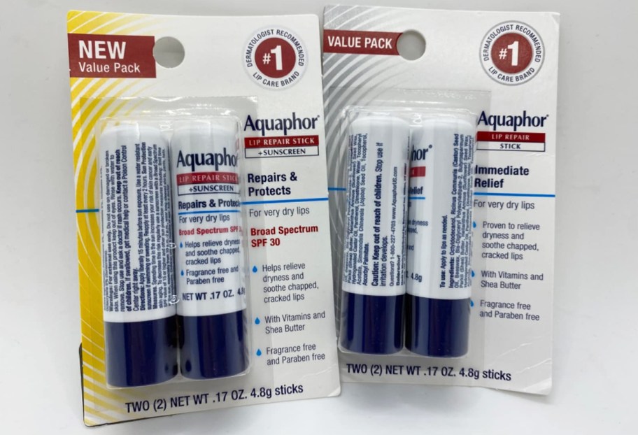two 2-packs of Aquaphor Lip Repair sticks