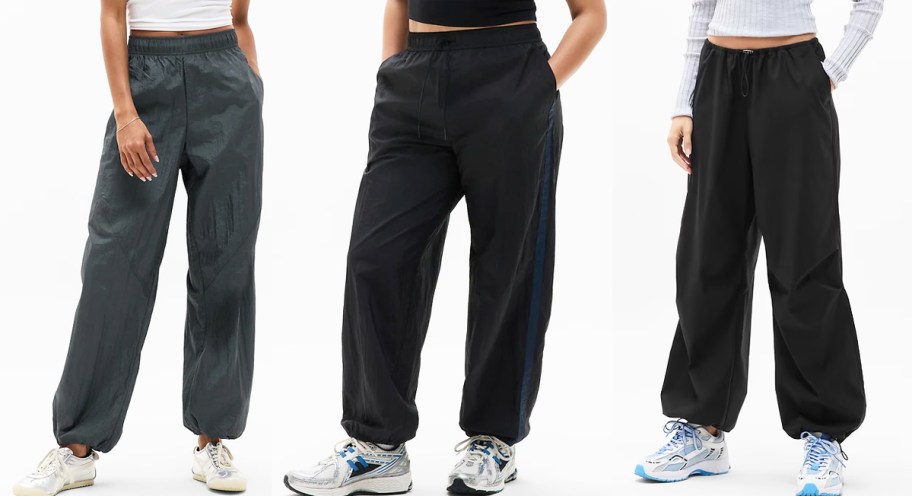 three women modeling grey and black joggers