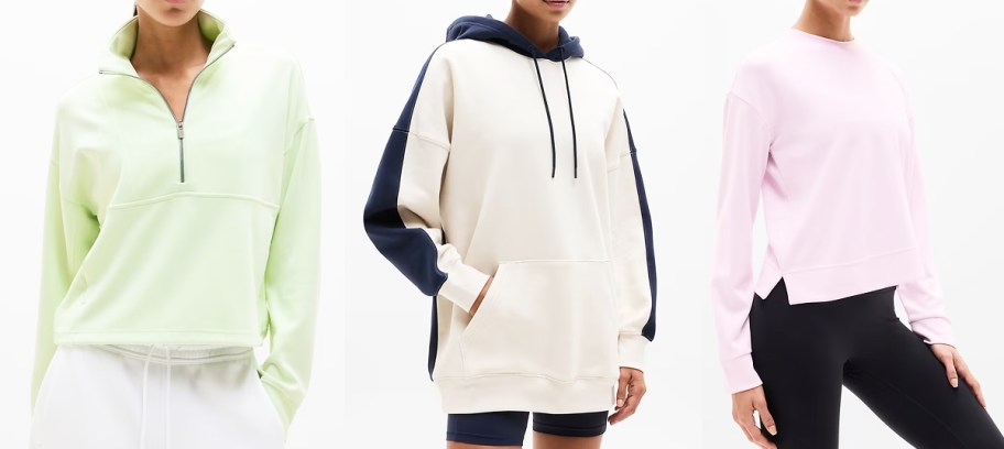 three women in green, white, and pink sweatshirts