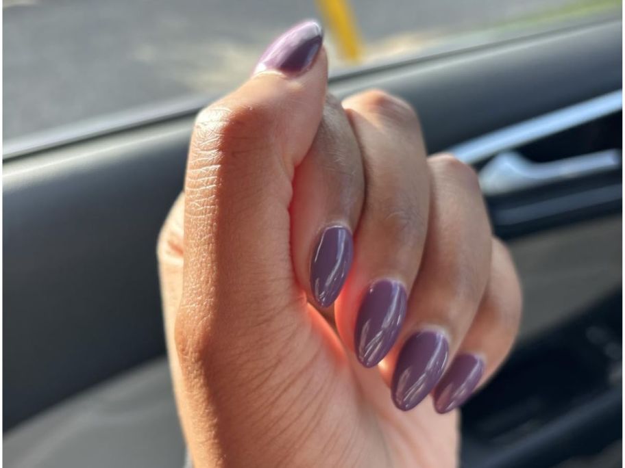 Woman's hand with Beetles Gel Nails on it
