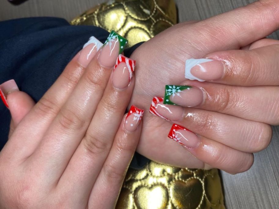 Woman's hands with Christmas themed nails