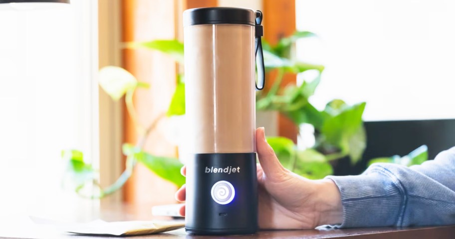 making a smoothie in a black BlendJet Portable Blender