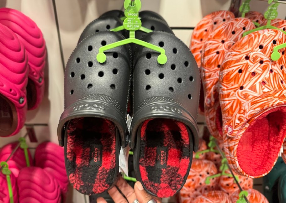 BLACK CROCS WITH PLAID LINING ON DISPLAY IN-STORE 