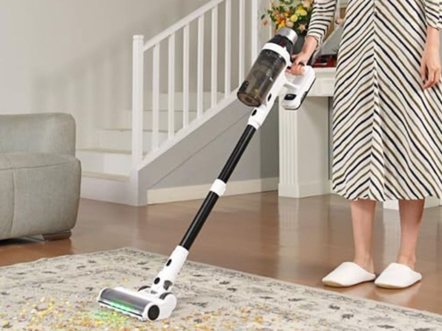 woman using a NuYupo Cordless 15-in-1 Vacuum Cleaner 