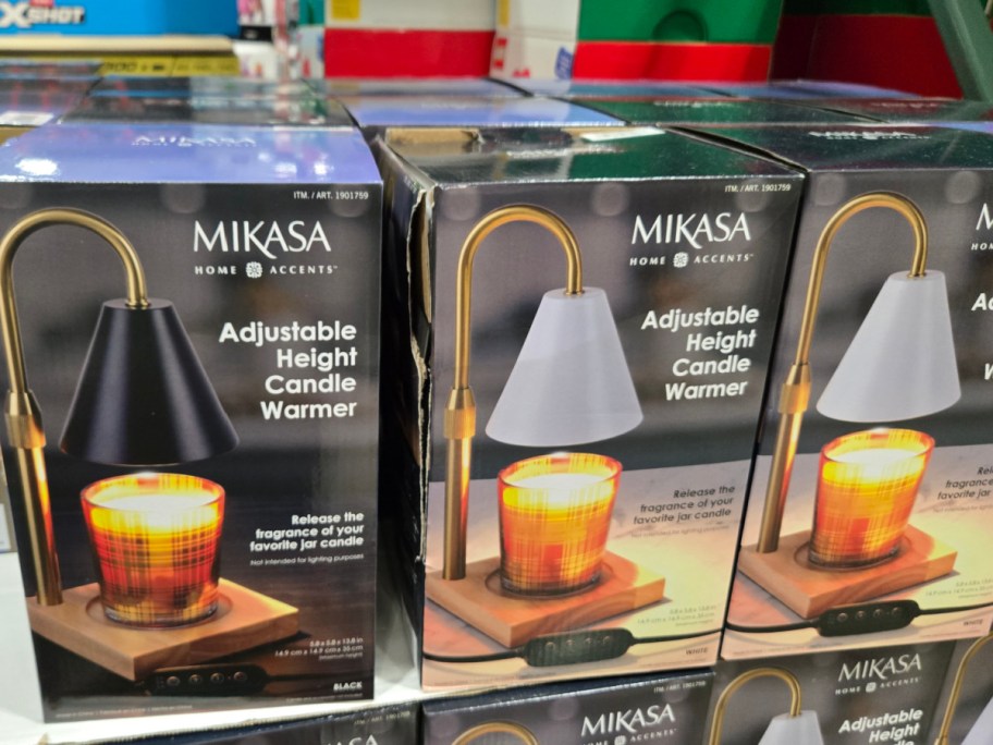 Three wax warming lamps in boxes.