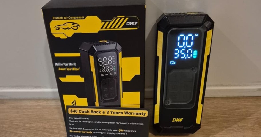 Portable air compressor displayed next to its box.