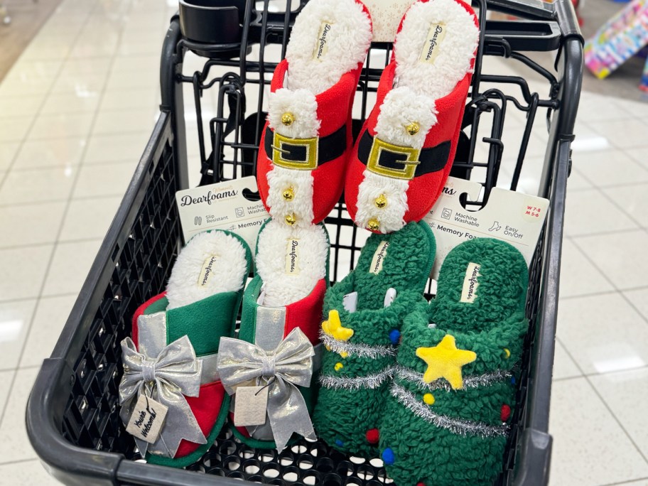three pairs of christmas slippers in a black shopping cart