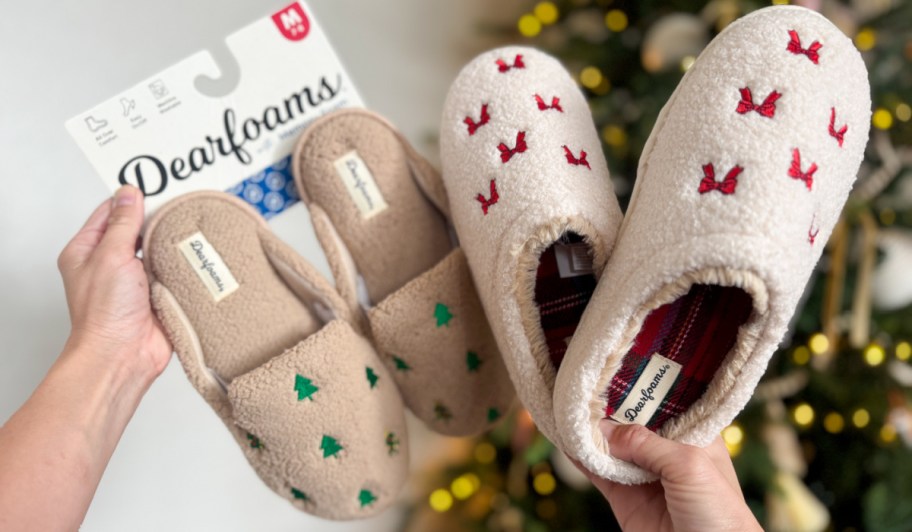 Woman holding up, dear phones slippers, featuring Christmas trees, and red bows