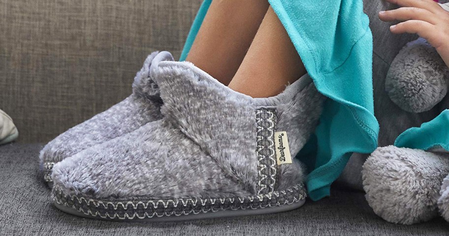 girl wearing a pair of grey slipper booties