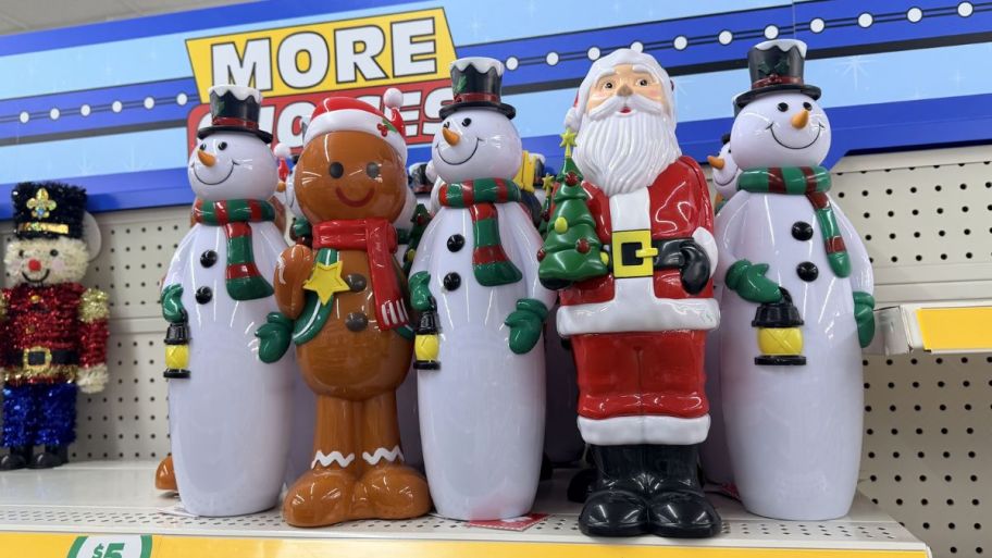 Dollar Tree Christmas statues displayed on a shelf