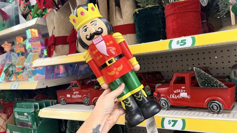hand holding Dollar Tree nutcracker