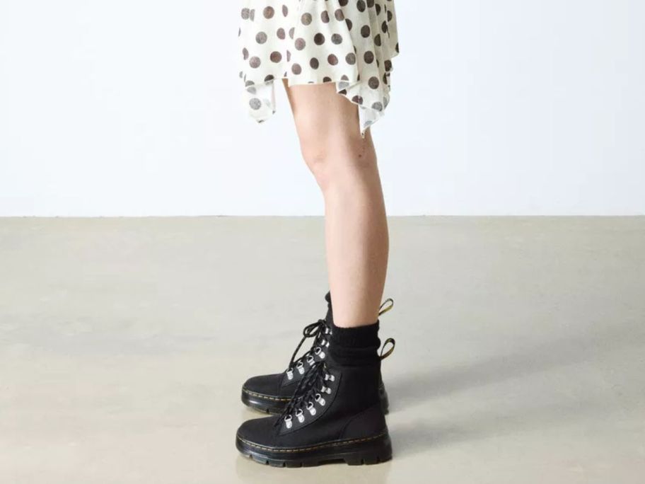 Woman's legs wearing Dr. Martens Women's Combs Boots