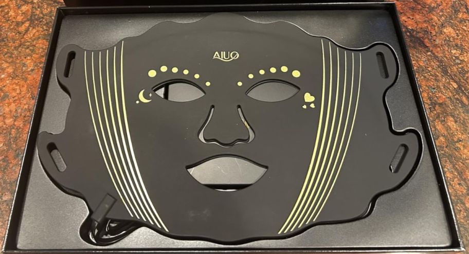 Black red light facemask inside of its box 