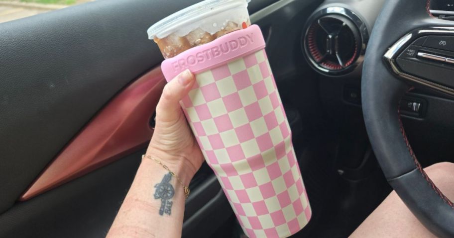 hand holding Frost Buddy Togo Buddy 30oz tumbler in car
