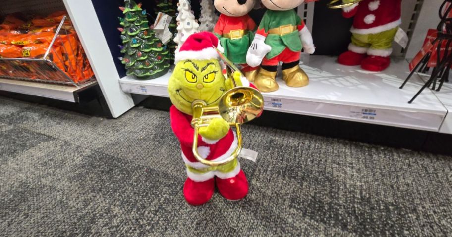 A small Grinch with a Trombone