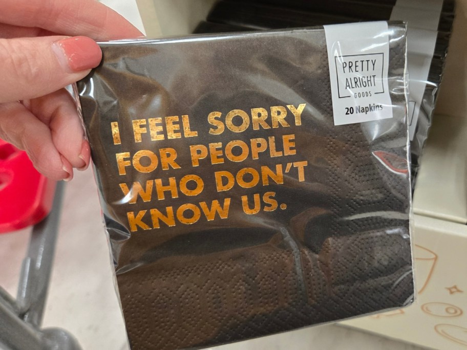 hand holding a pack of napkins that says 'I Feel Sorry For People Who Don't Know Us'